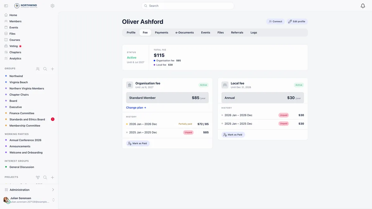 Member profile Fee tab with a total fee of 115 dollars split into organisation and local lines, an Organisation fee card showing 2026 partially paid at 72 of 85 and 2025 unpaid, a Local fee card showing two unpaid years, and a Mark as Paid button at the foot of each card