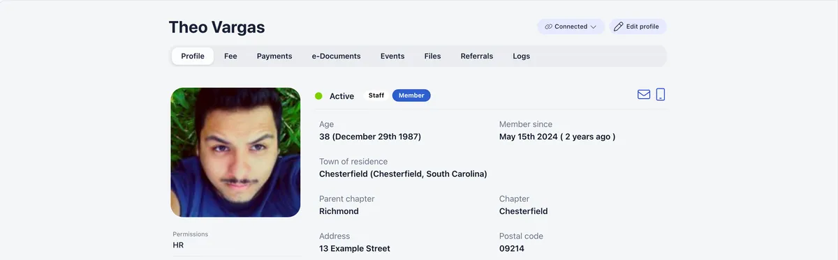 A member profile with a tab bar of Profile, Fee, Payments, e-Documents, Events, Files, Referrals and Logs, open on the Profile tab, where a green Active status badge sits beside Staff and Member tags above the member's age, join date, town of residence, parent chapter and chapter