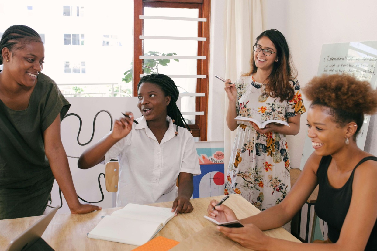 Women collaborating and sharing ideas in a community interest group